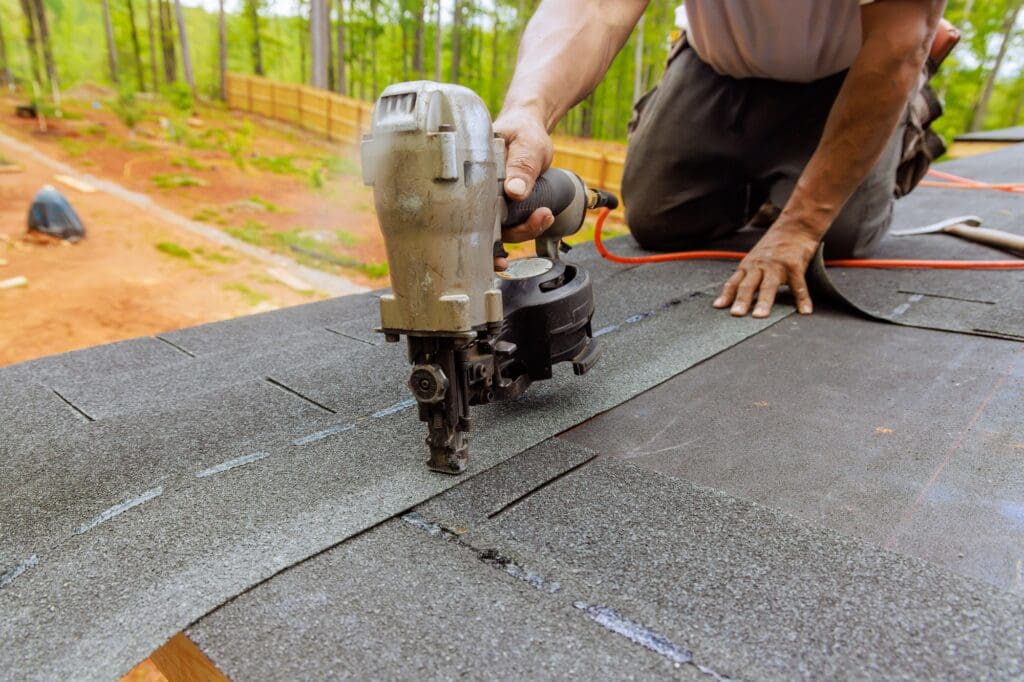 Roof Repair Technician Fixing Damaged Shingles on a Home in Katy, TX – Eternal Roofing