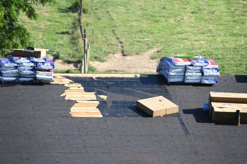 Expert roofer inspecting a roof in San Antonio, TX